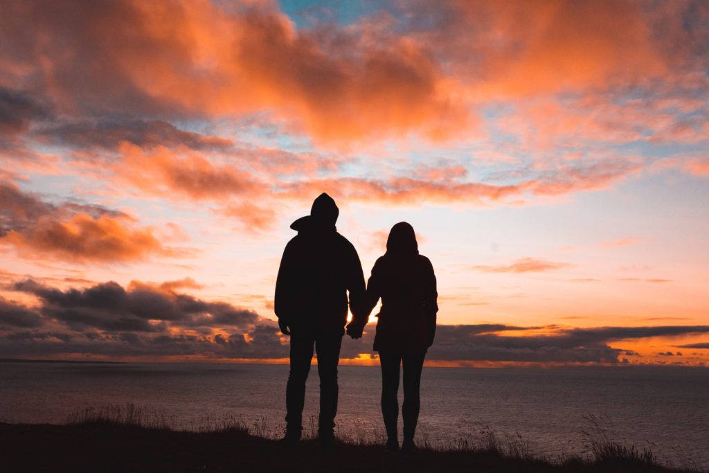 Couple holding hands - long distance date ideas