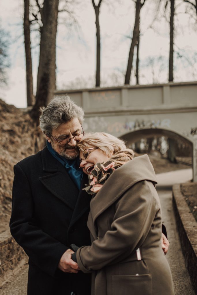 how-sex-changes-for-men-after-50-older-couple-walking-in-park-laughing