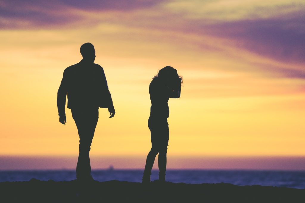 why-do-people-get-divorced-couple-fighting-under-yellow-sky