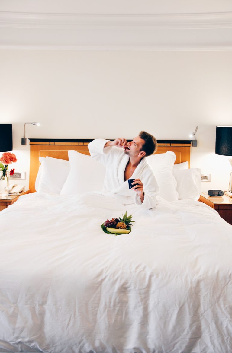sex-tips-for-men-man-eating-fruit-on-bed